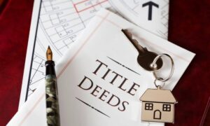 Title deed and property map reviewed as part of an ALTA Land Title Survey during a real estate transaction