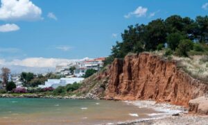 A steep eroded coastline showing how shifting land can affect the accuracy of a topographic survey