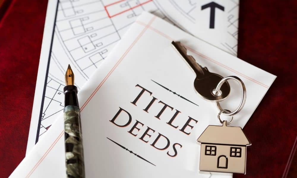 Title deed and property map reviewed as part of an ALTA Land Title Survey during a real estate transaction