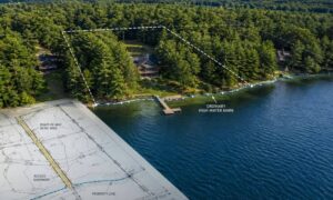 Plat of survey waterfront access rights - ALTA SURVEY Maine Aerial view of a waterfront property with a dashed boundary line over trees, a dock, and a house along the lake shore